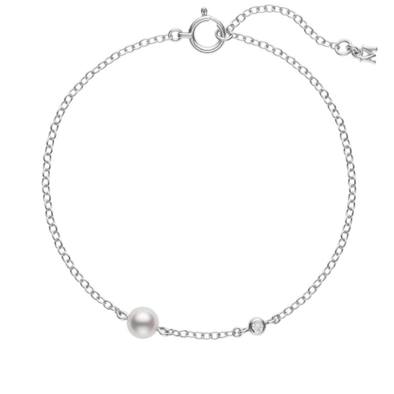 Mikimoto 18k white gold rhodium plated Station bracelet with a pearl and a diamond, 5mm/A+ akoya pearl and a round diamond weighing 0.02 carat weight, 7"/6.25"