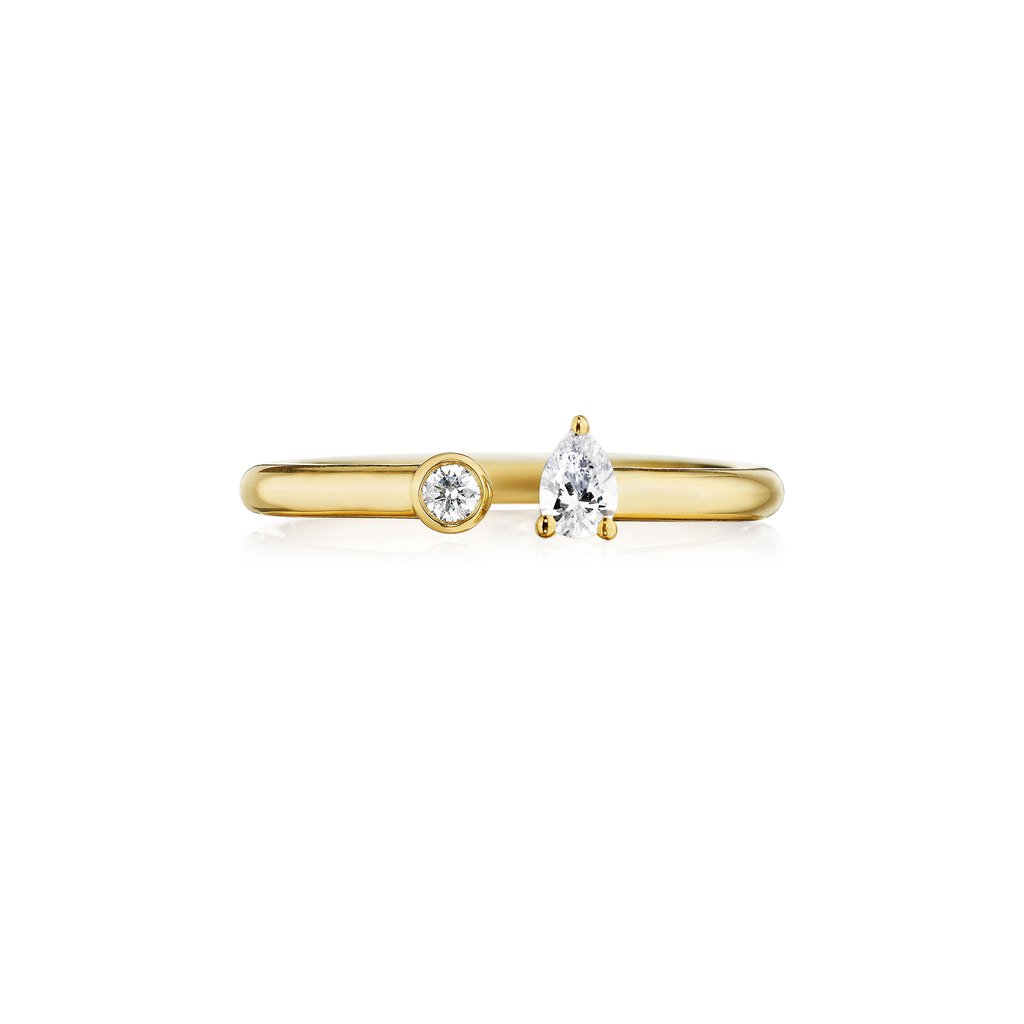 Penny Preville 18k yellow gold negative space band with round diamonds and a pear shape diamond weighing 0.40 carat total weight