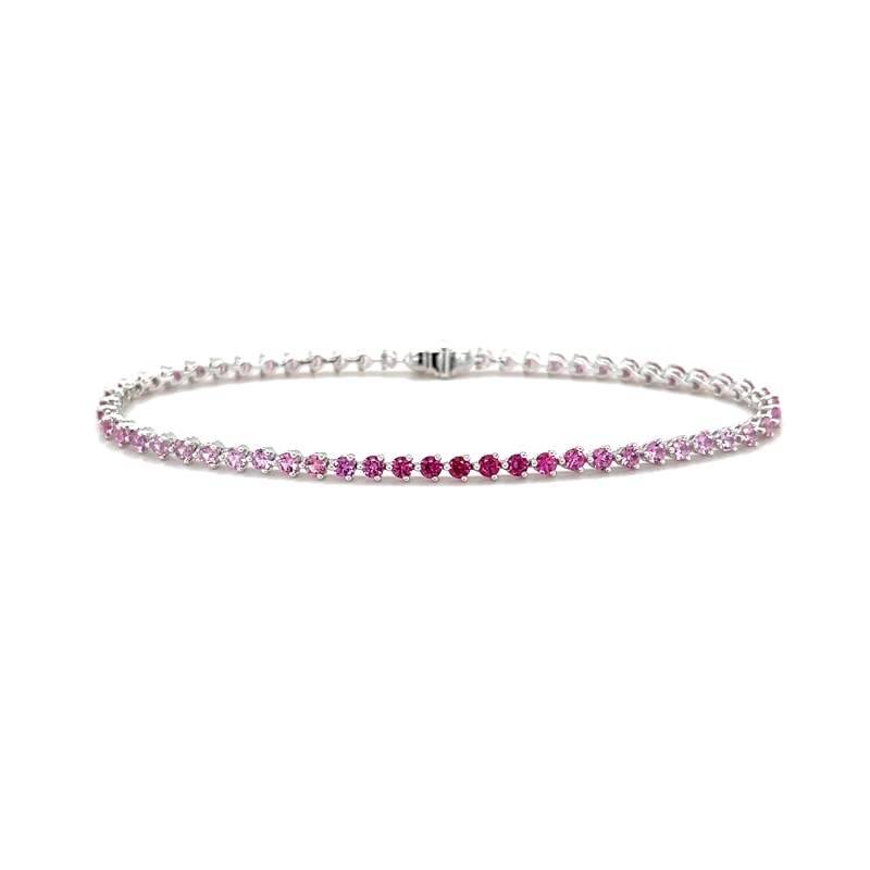 Lisa Nik 18k white gold rhodium plated Rainbow 3-prong tennis bracelet with ombre pink sapphires weighing 3.55 carats total weight